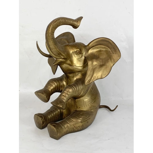 206 - A large heavy brass elephant. 37 x 46cm