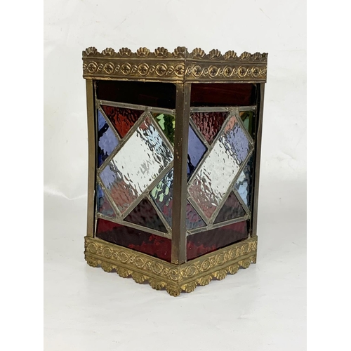 22 - A Victorian brass hall lanterns with 4 stained glass panels. 15.5 x 26.5cm