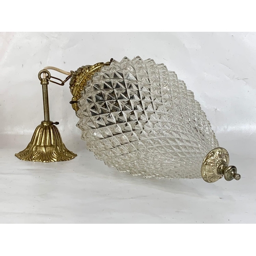 235 - A pair of large vintage brass light fitting with glass shades. 61cn