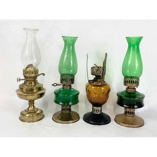 242 - A quantity of oil lamps. Tallest 41cm