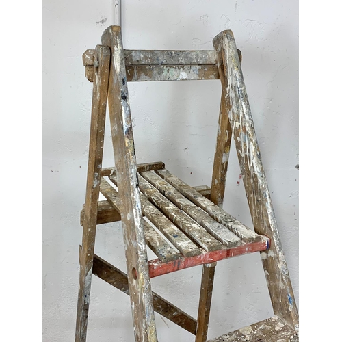 243 - A large vintage wooden step ladder. 199cm folded.