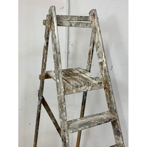 244 - A large vintage wooden step ladder. 198.5cm folded.