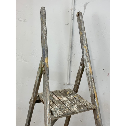 246 - A large vintage wooden step ladder. 207cm folded.