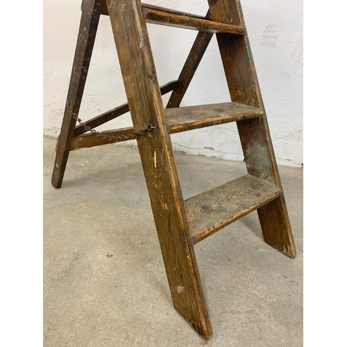 258 - An early 20th century pine step ladder. 96cm closed