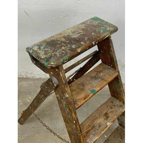 258 - An early 20th century pine step ladder. 96cm closed