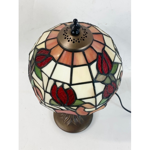 259 - A Tiffany style table lamp. 38cm