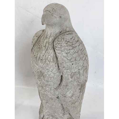 261 - A pair of concrete garden eagles ornaments. 46cm