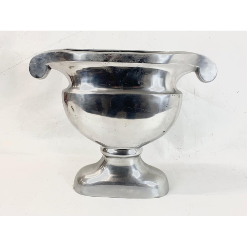 268 - A chrome urn. 50 x 40cm