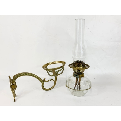 28 - A Victorian wall hanging oil lamp. 34 x 42cm.