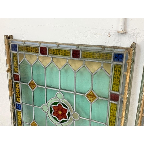 280 - A pair of large Victorian stained glass panels. 71.5 x 114cm