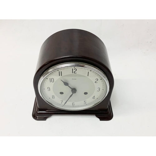 286 - A vintage Bakelite mantle clock by Enfield. 22 x 20cm