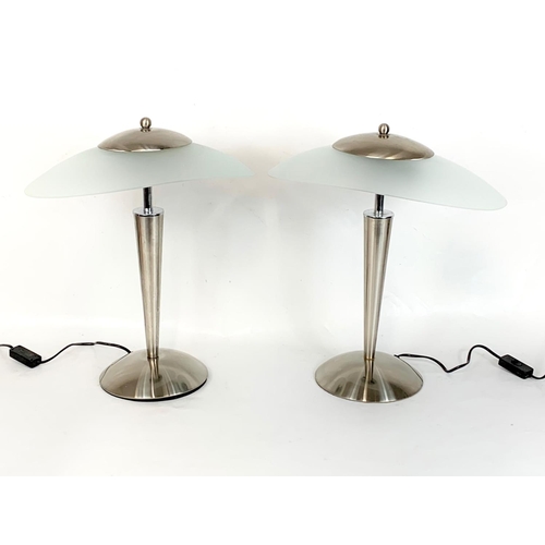 32 - A pair of Art Deco style chrome table lamps with frosted glass shades. 41 x 48cm.