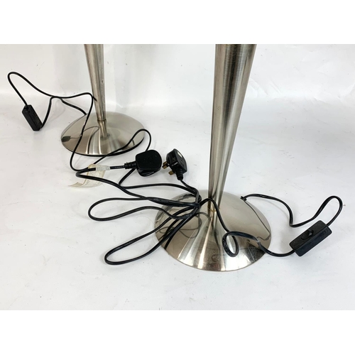 32 - A pair of Art Deco style chrome table lamps with frosted glass shades. 41 x 48cm.