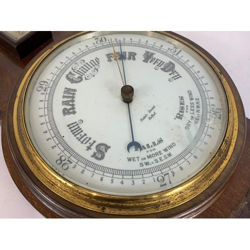 35 - A late Victorian oak barometer. 82cm.