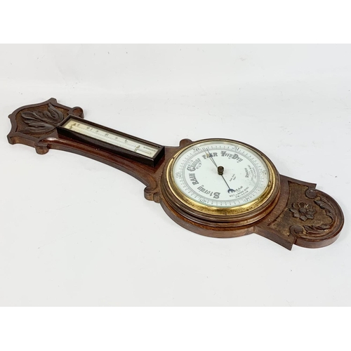 35 - A late Victorian oak barometer. 82cm.