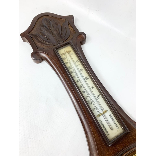 35 - A late Victorian oak barometer. 82cm.