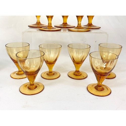 395 - 2 sets of vintage drinking glasses. A set of 5 gold rimmed glazed 7.5cm, 6 small Amber Glass Sherry ... 