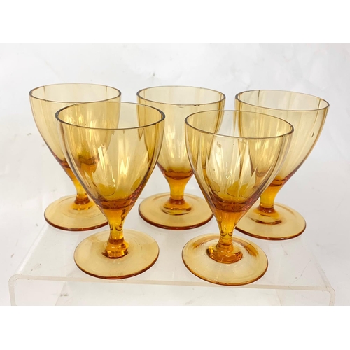 395 - 2 sets of vintage drinking glasses. A set of 5 gold rimmed glazed 7.5cm, 6 small Amber Glass Sherry ... 