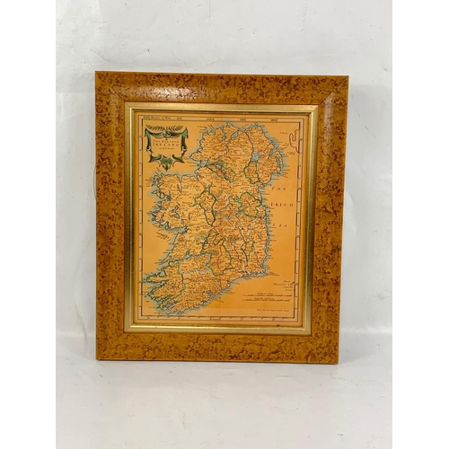 41 - An old style map of Ireland in a Birdseye Maple frame. 36 x 42cm.