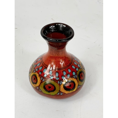 411 - A small Luigi Santi pottery vase. Italy. 10cm