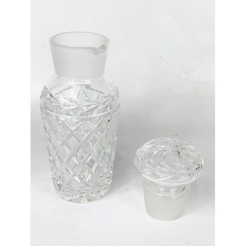 417 - A large Waterford crystal decanter with spout. 28cm