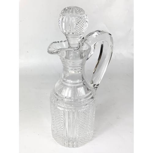 418 - A large Waterford crystal claret jug. 18.5 x 30cm