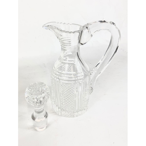 418 - A large Waterford crystal claret jug. 18.5 x 30cm