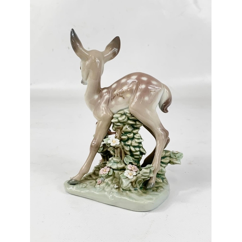 422 - A Lladro “A Faun and a Friend” porcelain figure. 12 x 15cm.