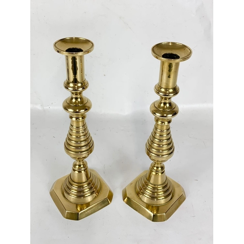 427 - A pair of large Victorian brass candlesticks. 31cm.