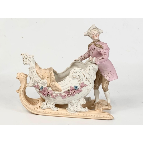 459 - A late 19th century German Bisque porcelain figure. 20 x 18cm.