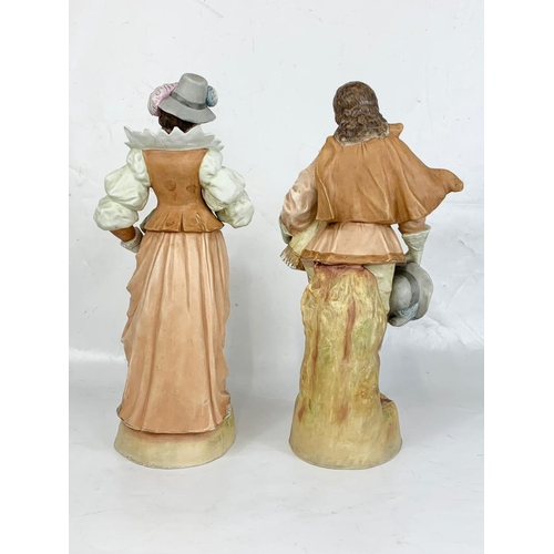 462 - A pair of large late 19th century Austrian bisque pottery figures. 43cm.