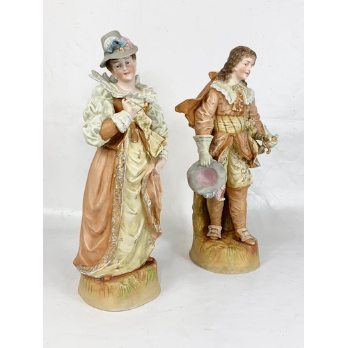 462 - A pair of large late 19th century Austrian bisque pottery figures. 43cm.