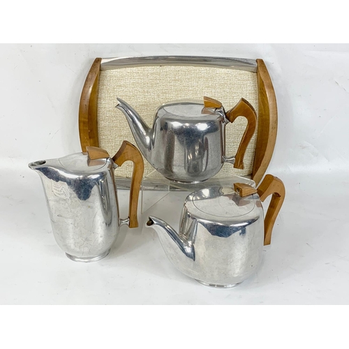 479 - A 4 piece Picquot Ware Mid Century tea service.