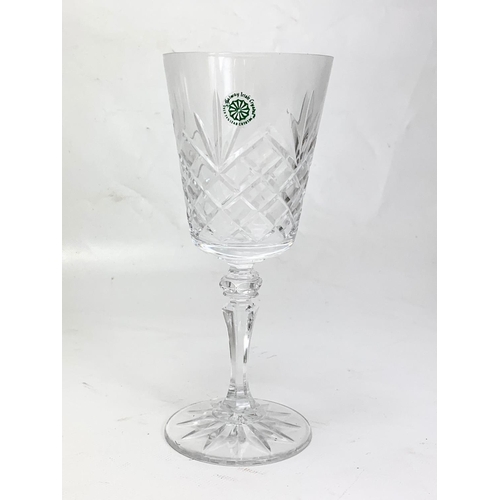 484 - A set of 13 Galway Crystal wine glasses. 20cm.