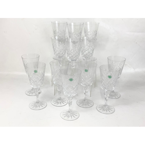 484 - A set of 13 Galway Crystal wine glasses. 20cm.