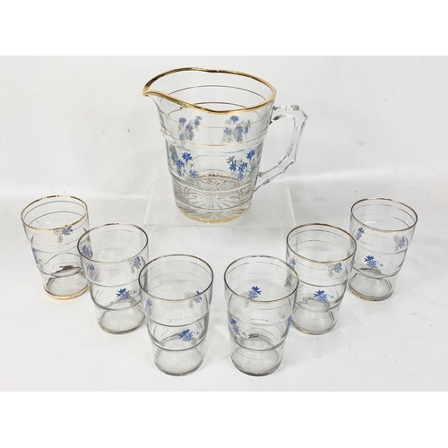 498 - A 1960’s drinks set. A pitcher and 6 matching glasses