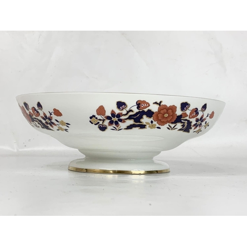 505 - A collection of Aynsley “Bird of Paradise” pottery. Including a large bowl 26 x 8.5cm and a jardinie... 