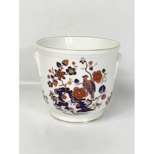 505 - A collection of Aynsley “Bird of Paradise” pottery. Including a large bowl 26 x 8.5cm and a jardinie... 