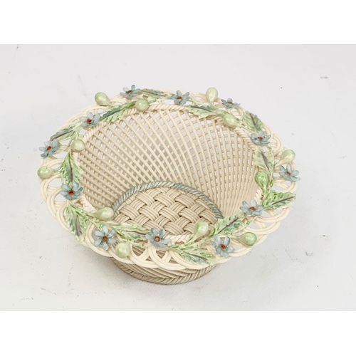 520 - A Belleek woven pottery basket. 15 x 6cm.