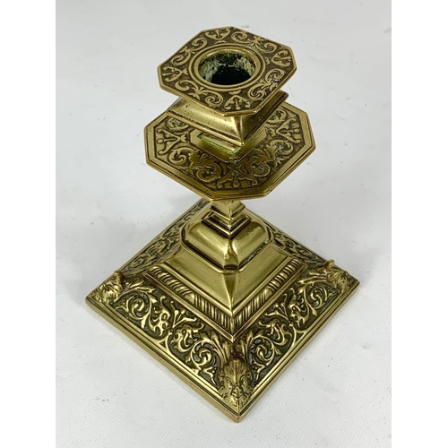 527 - A pair of Victorian brass candlesticks. 10.5 x 15.5cm