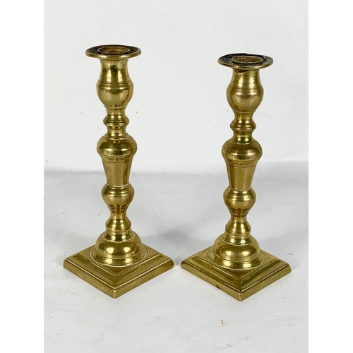 528 - A pair of Victorian brass candlesticks. 24cm