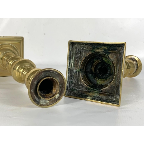 528 - A pair of Victorian brass candlesticks. 24cm