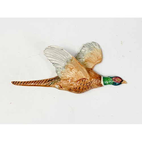 533 - A Beswick pottery bird. 26.5cm