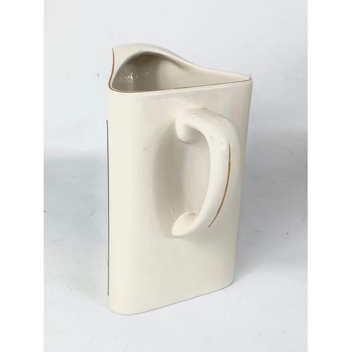 534 - 5 Guinness pottery water jugs. 18cm.