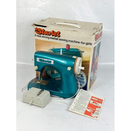 54 - A vintage Starlet sewing machine in box