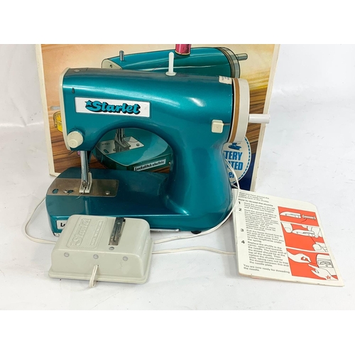 54 - A vintage Starlet sewing machine in box