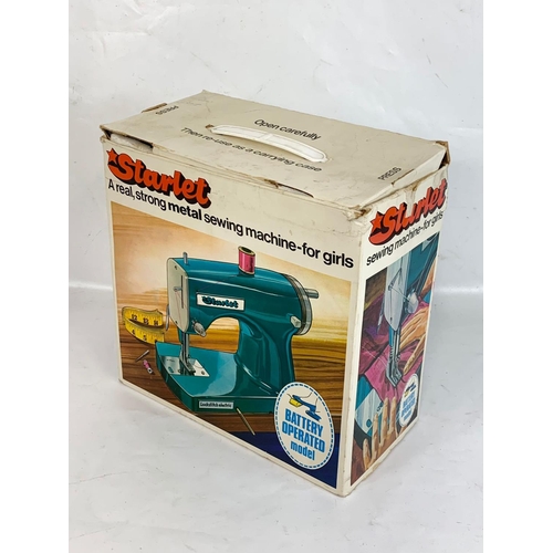 54 - A vintage Starlet sewing machine in box