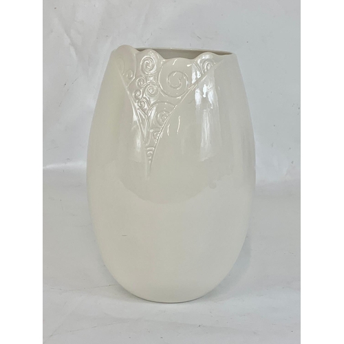 543 - A Belleek Living pottery vase in box. Vase measures 22.5cm