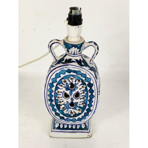 553 - A vintage Chinese style blue and white pottery table lamp. 33cm