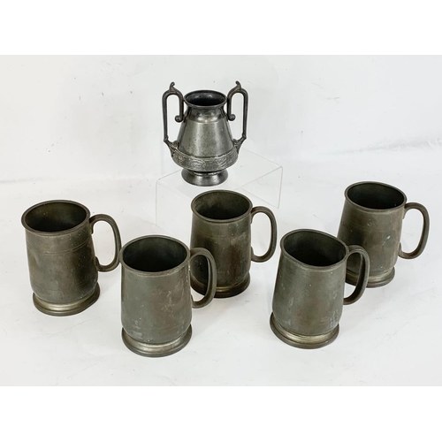 557 - 5 pewter mugs and a Wilcox silver plate 2 handles vase.